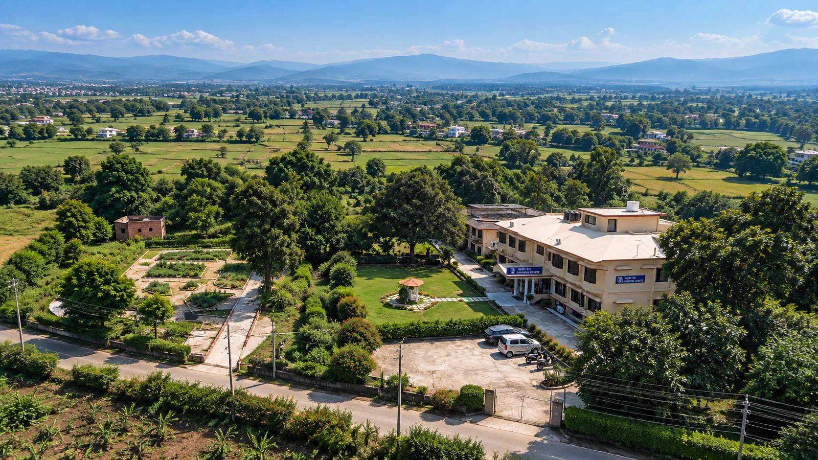 The Ayurveda Centre campus with the Himalayan foothills behind