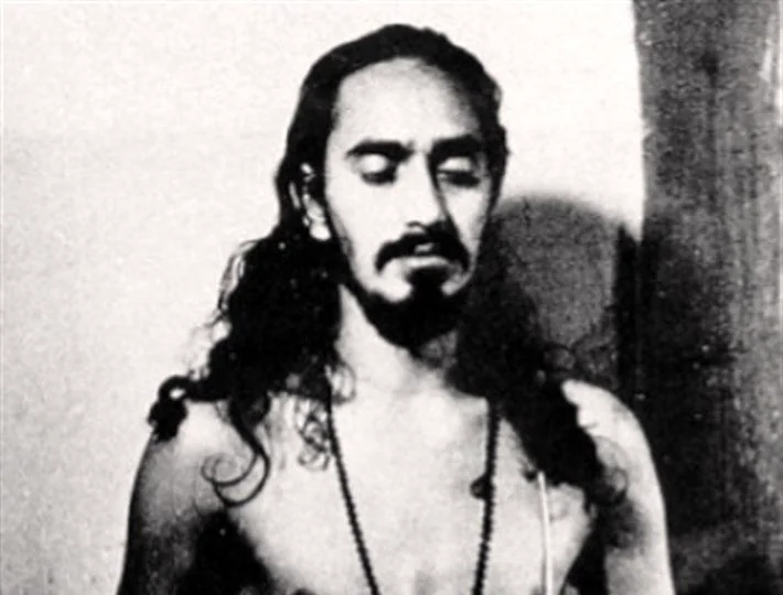 Young Swami Rama seated in meditation